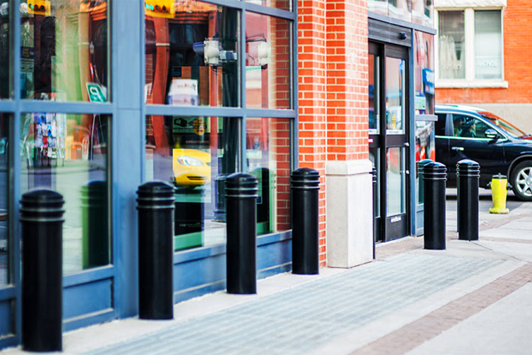 Crash-rated bollards along storefronts can prevent cars from skidding into storefronts under icy conditions.