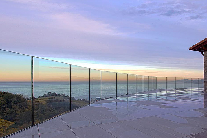 Structural glass railings systems have no posts and thin, optional cap rails. Enjoy your view with zero visual obstruction!