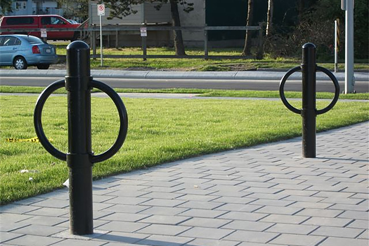Post and ring bicycle racks provide two points of contact with the bike frame.
